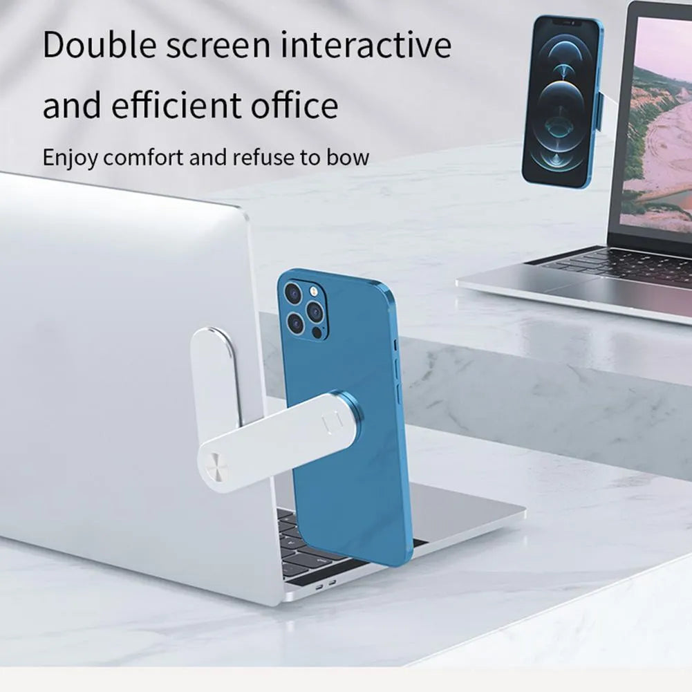Black aluminium laptop phone holder with magnetic bracket mounted on a monitor, showing a smartphone attached for dual-screen use