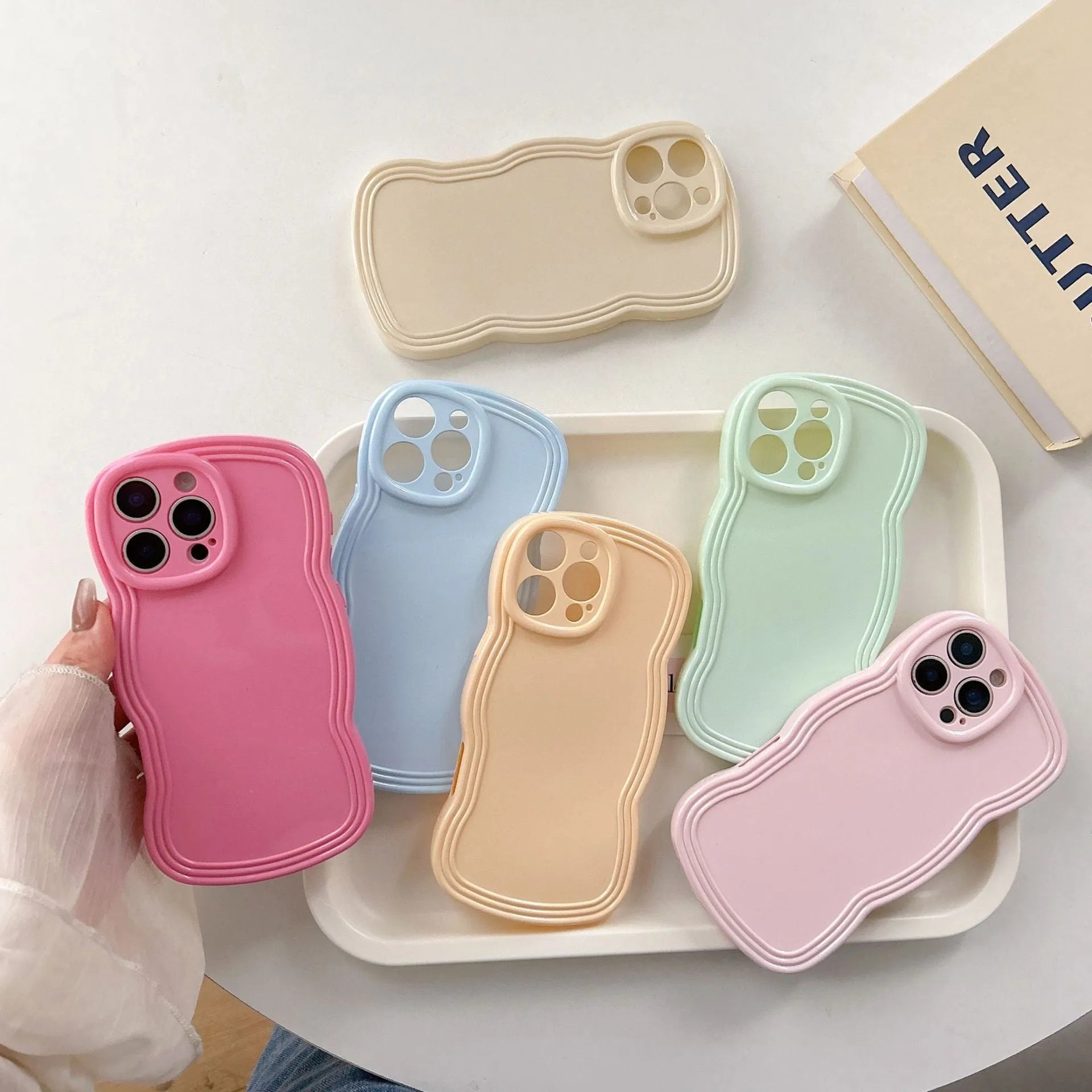 Cream candy colour wave pattern TPU phone case for iPhone models on plain background