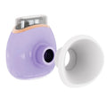 White and purple personal eye humidifier device with USB charging cable on a table.