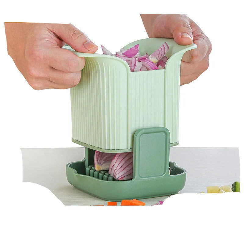 Green manual vegetable chopper with stainless steel blades for slicing onions, potatoes and cucumbers