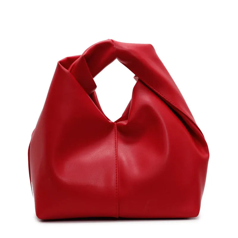Dumpling-shaped women's handbag in various colours showing sandwich pocket design and fold-stitch details