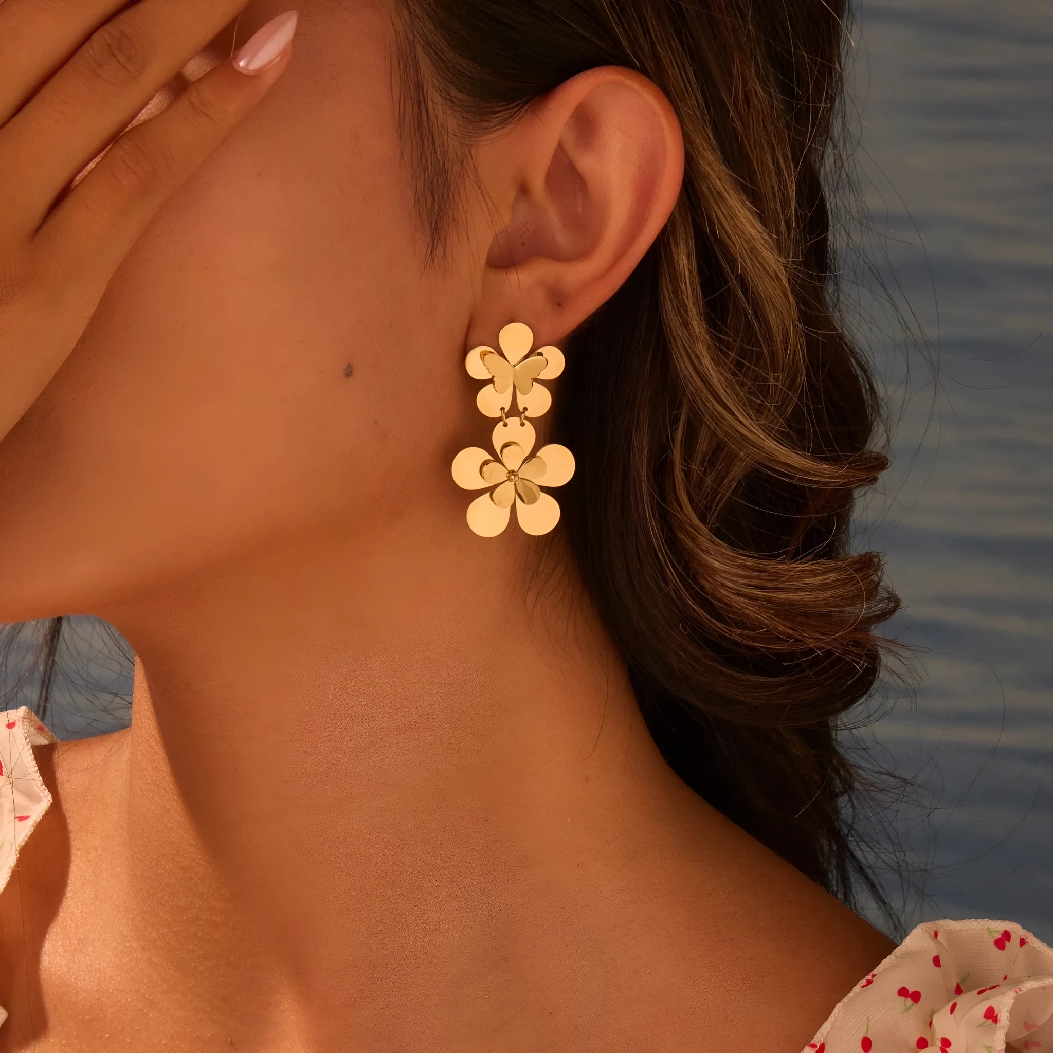 Gold-coloured stainless steel women's earrings with butterfly and flower geometric design