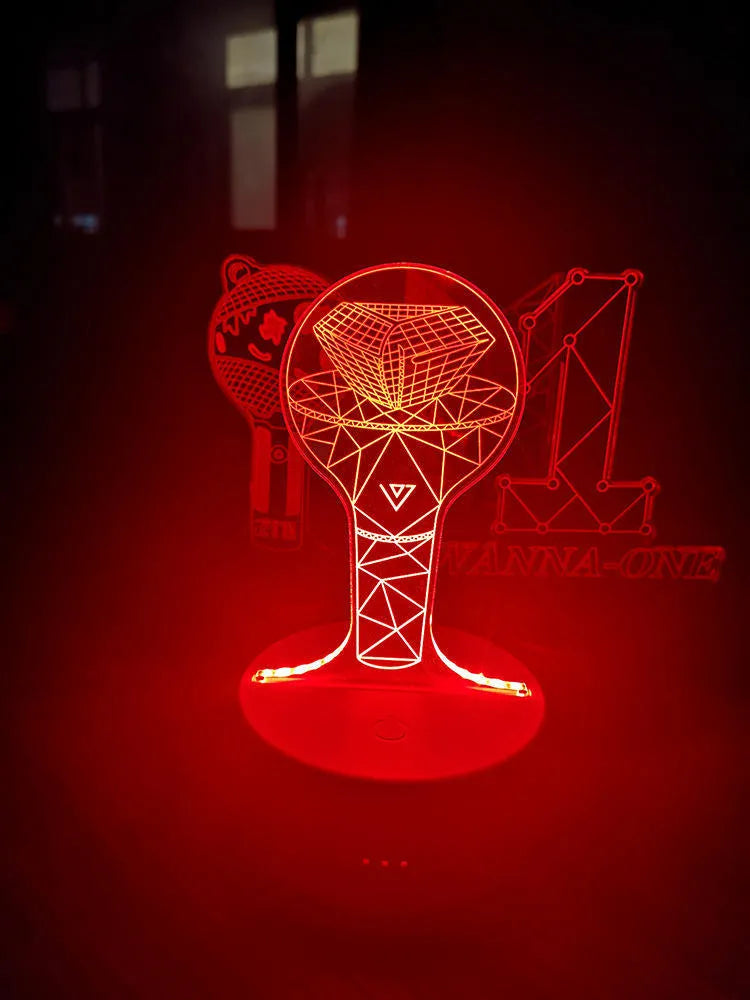 BTS-themed acrylic light-up display stand holding BTS Light 101 Tower Gem collectible