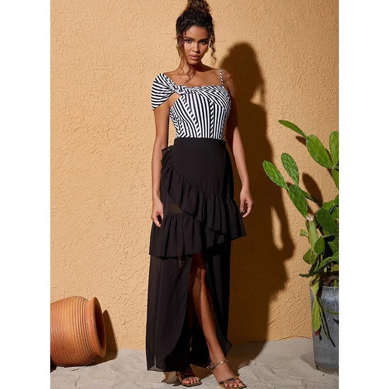 Women's one-piece swimsuit with ruffled striped design and attached skirt in polyester fabric