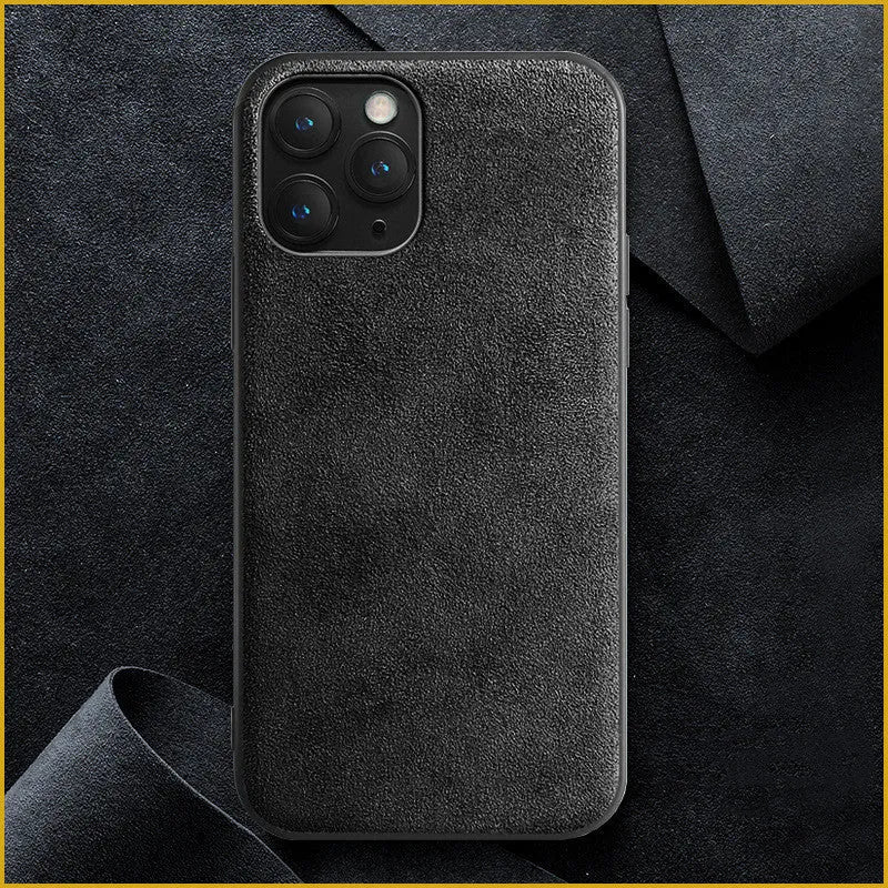 A luxury suede iPhone back cover in dark blue, shown fitted on a smartphone.