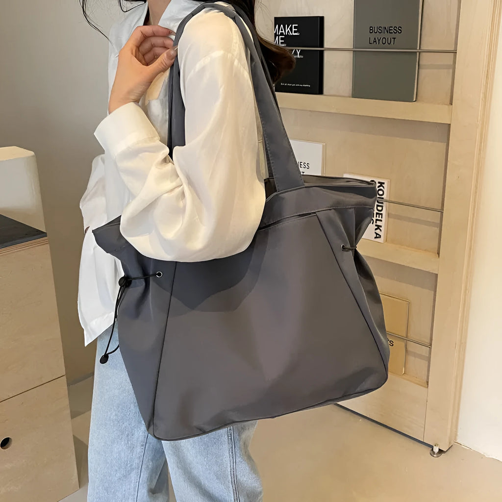 Soft foldable Oxford cloth tote bag in street style, shown in a choice of five colours.