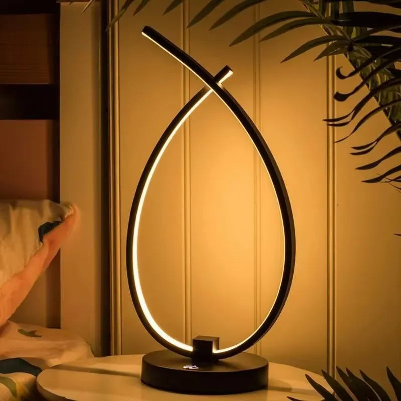 Small black or white creative desk lamp with USB cable, 30cm tall on a wooden table.
