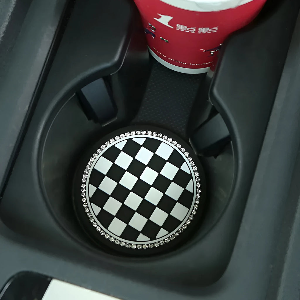 Black and white checkerboard plastic car cup mat placed in a vehicle door slot.