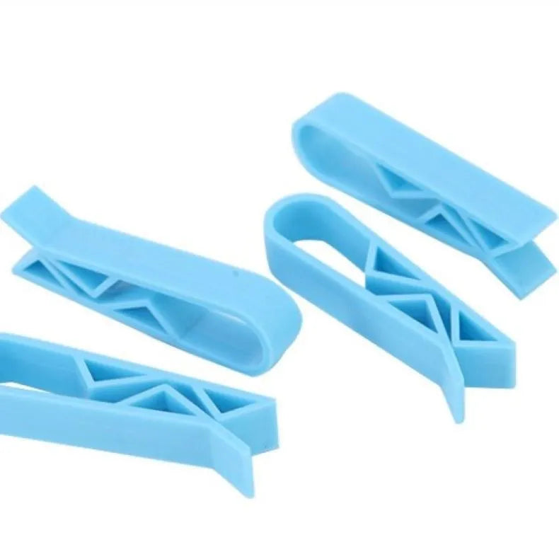 Black plastic non-slip clip for holding bin bags on the side of a trash can.