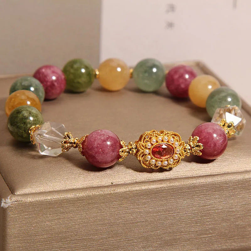 Jade colour tourmaline bracelet for women with alloy setting and rhinestone details on pearl crystal base.