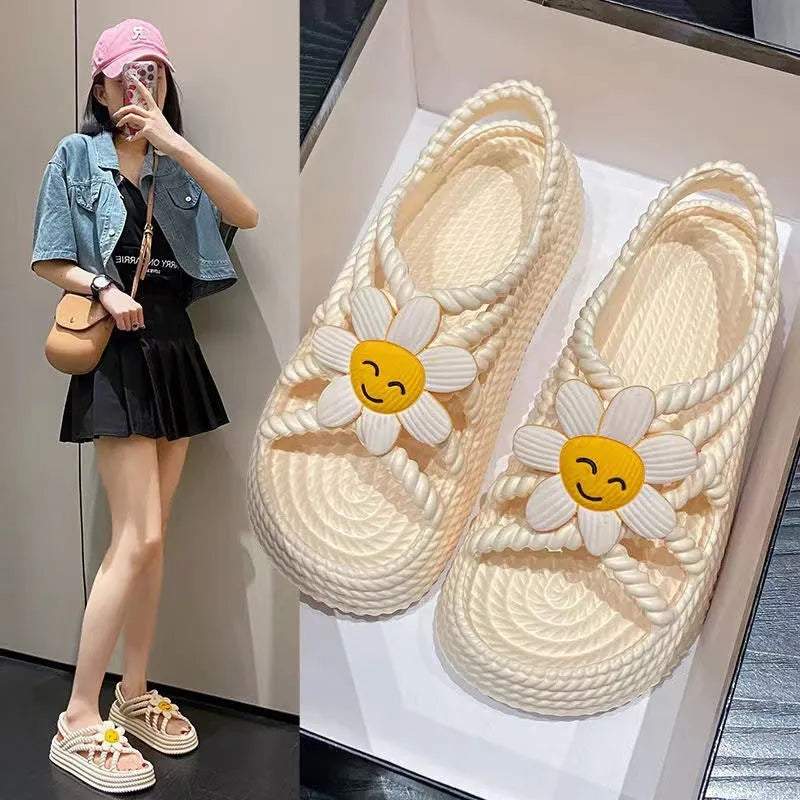 PVC round-toe sandals with a non-slip sole in beige colour with a sunflower decoration.