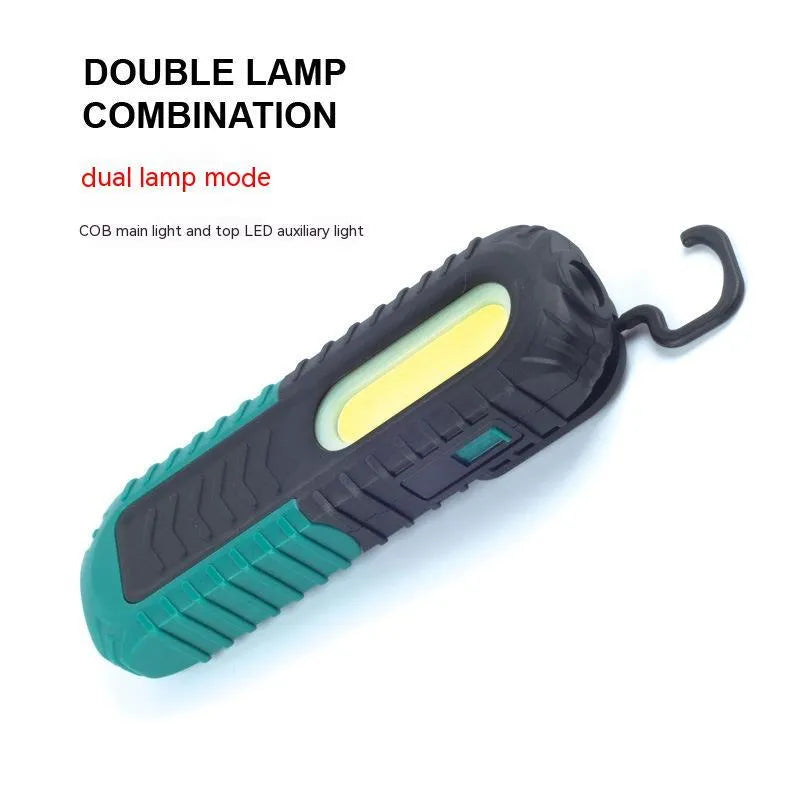 Black and green USB rechargeable auto repair work light with a durable plastic housing.