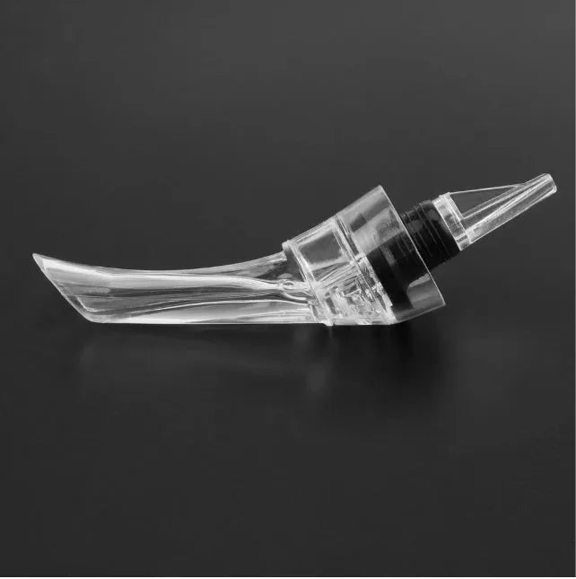 Wine aerator with stainless steel filter, measuring 16cm in length and 4.2cm in diameter, on a glass with red wine.