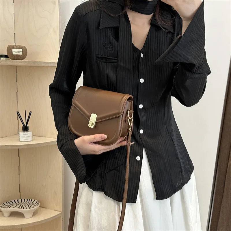 Niche Texture Shoulder Messenger Bag in clamshell design with soft PU material, shown in horizontal square shape.
