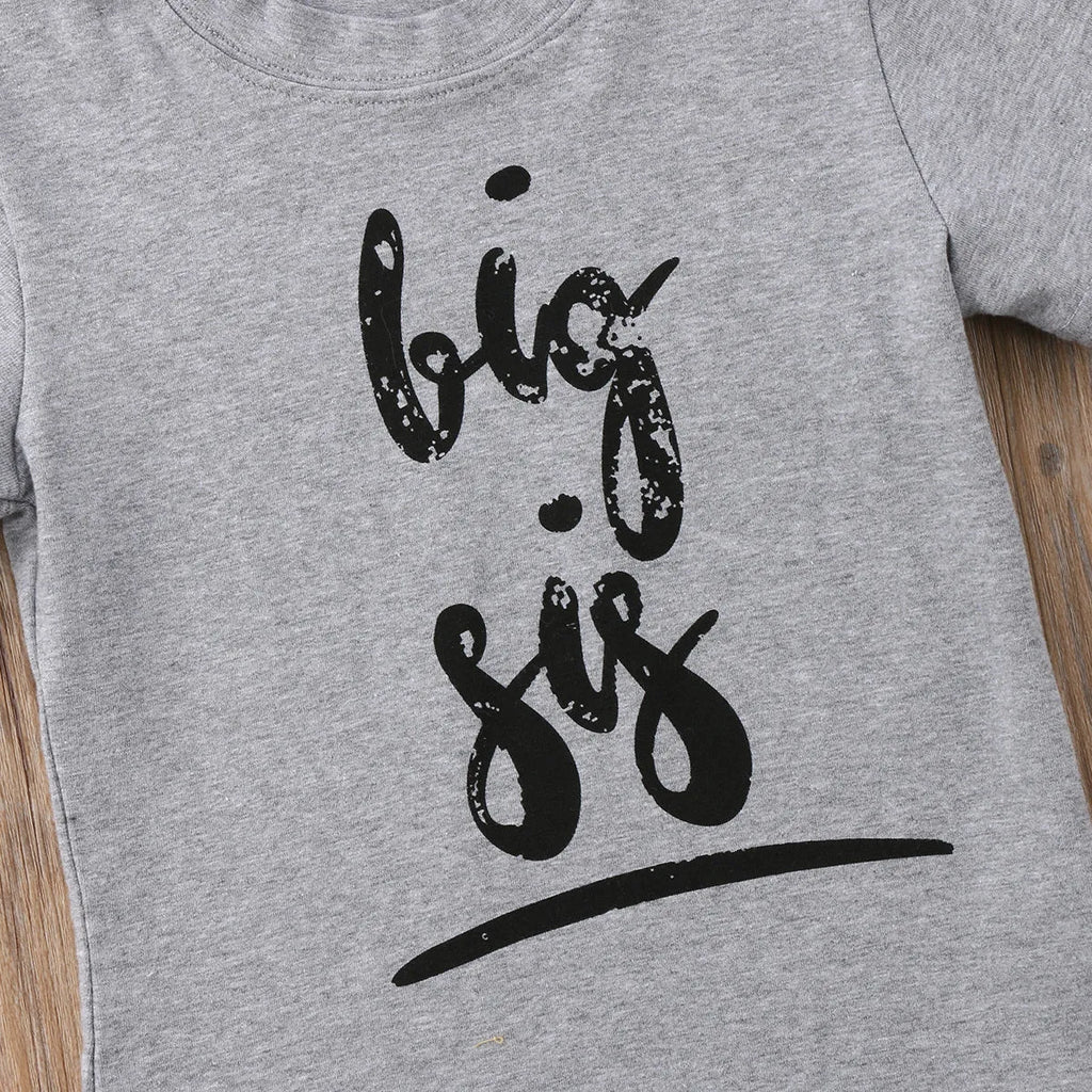 A grey printed cotton t-shirt for children showing a screen-printed graphic design on the front.