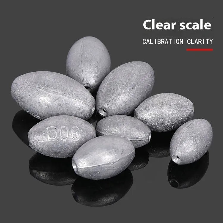 Scale Tongxin rugby shape fishing sinker with plastic core, showing scale pattern texture and tapered ends for sea fishing