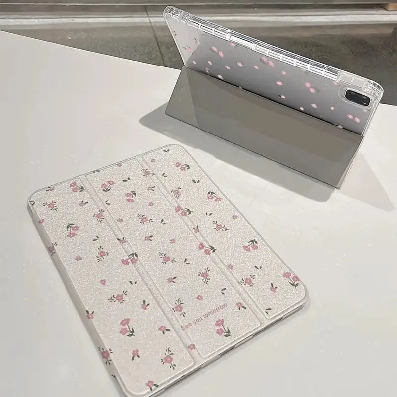 Transparent floral tri-fold protective case for Apple iPad showing magnetic bracket function
