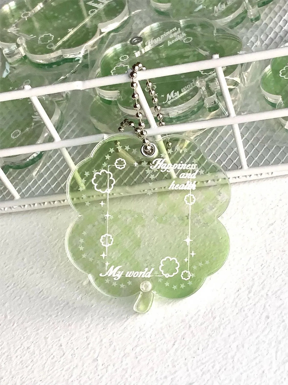 Blue, green, and mint green four-leaf clover acrylic phone pendant keychain.