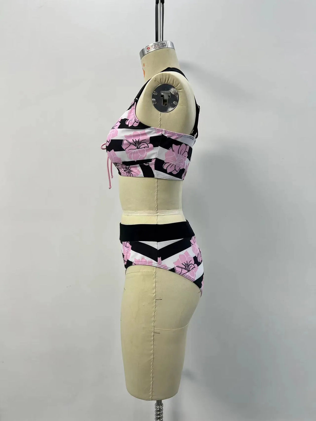 Black women's split bikini with belly-covered slimming design for swimming.