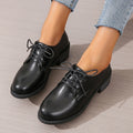 Black women's shoes with chunky 3-5cm heel, low-top design, and rubber sole for hiking