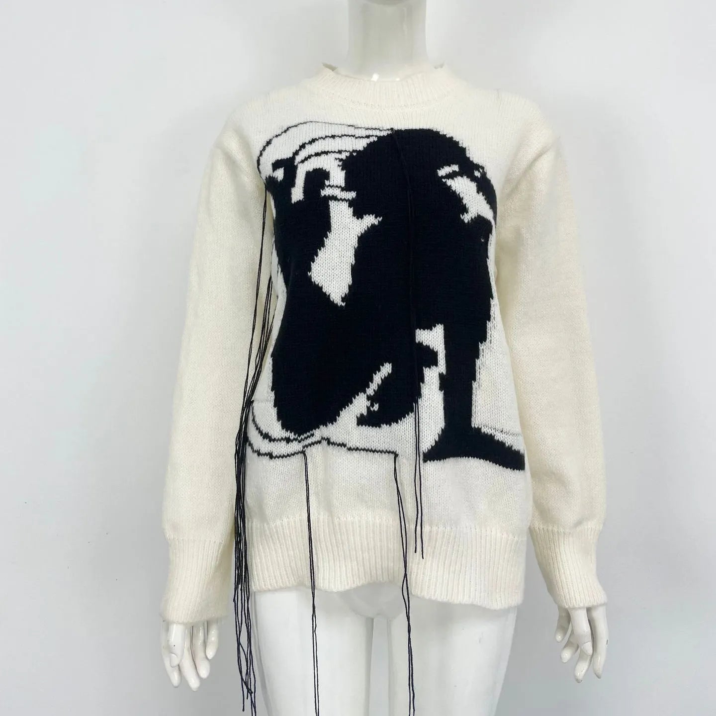 Grey women's alpaca wool pullover sweater with abstract pattern and tassel detail, loose street fashion fit.
