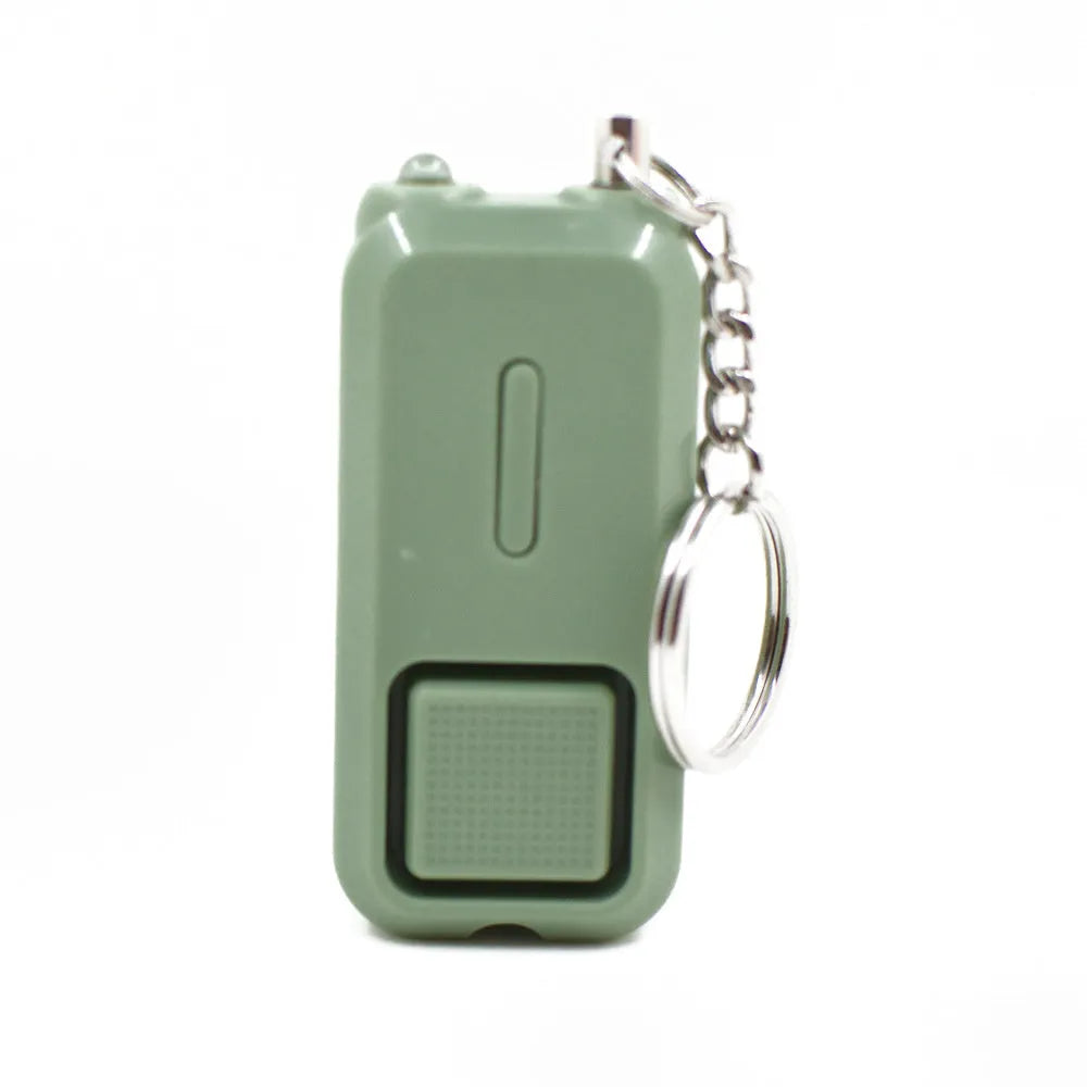 ZQ-202 personal safety alarm in pink, showing compact size of 65mm by 30mm.