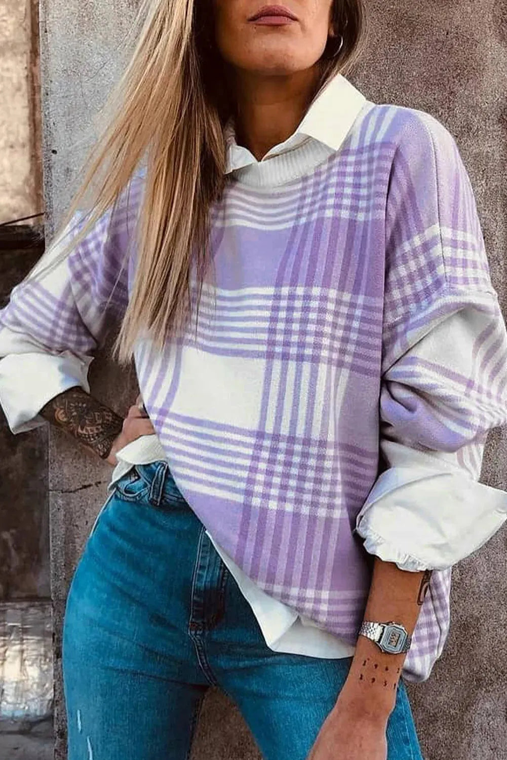Lilac plaid print loose sweater with ribbed trim and long sleeves, shown in a relaxed fit.