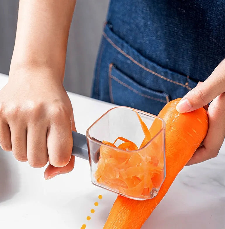 Creative stainless steel kitchen peeler with a coloured PP handle on a white background.