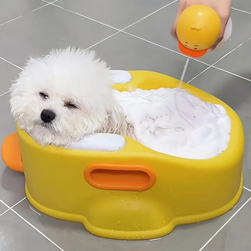 A blue PVC duck-shaped pet bathing pool for dogs and cats on a bathroom floor.