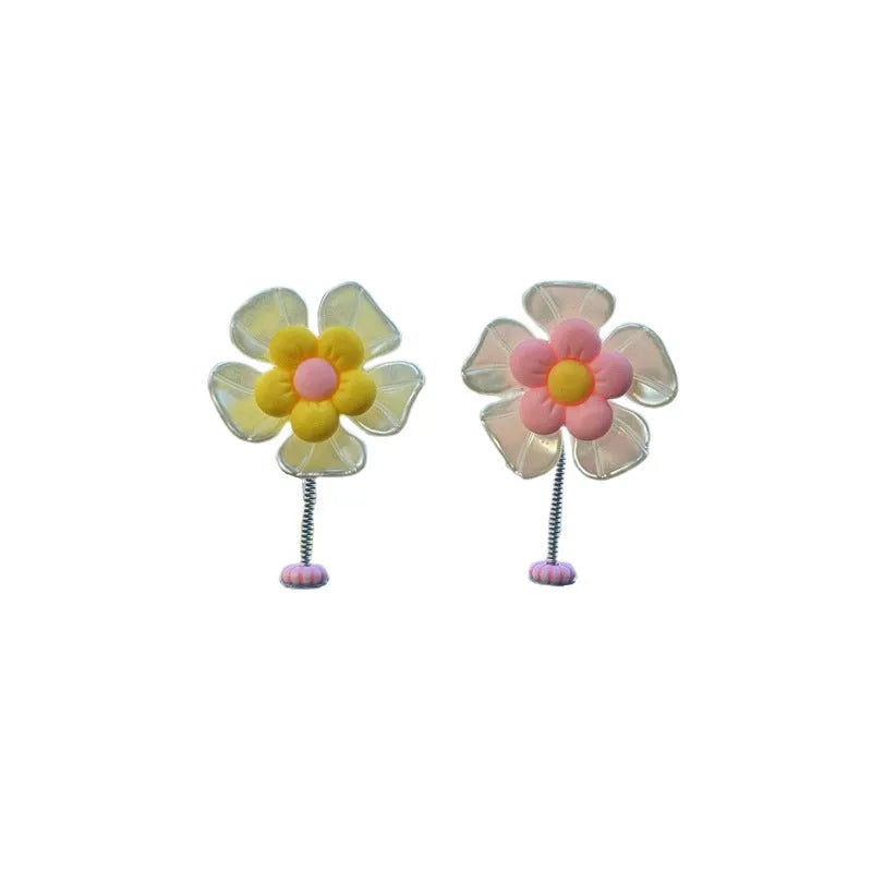 Plastic car swing decoration measuring 5cm tall in blue, green, pink, purple, and yellow colour options