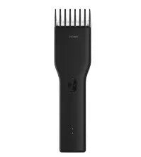 Black and white cordless hair clippers with adjustable comb, nano-ceramic cutter head, and two-speed control for precise haircuts