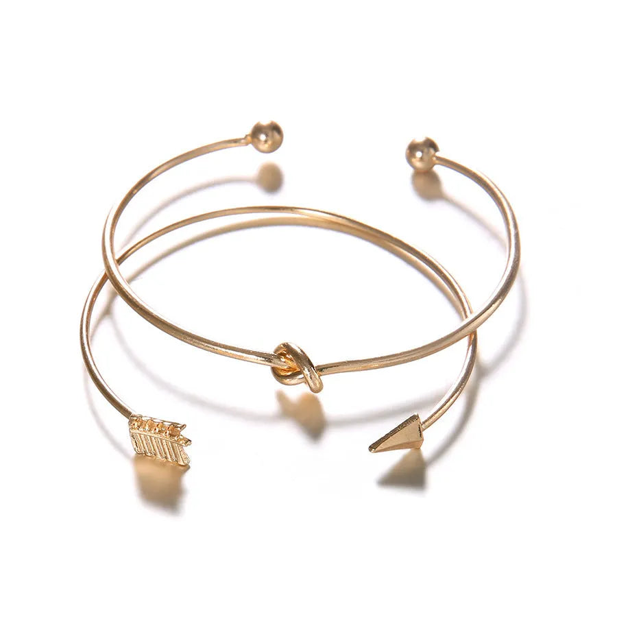 Women's vintage cuff arrow knotted bracelet with 2.5cm width and electroplated gold finish