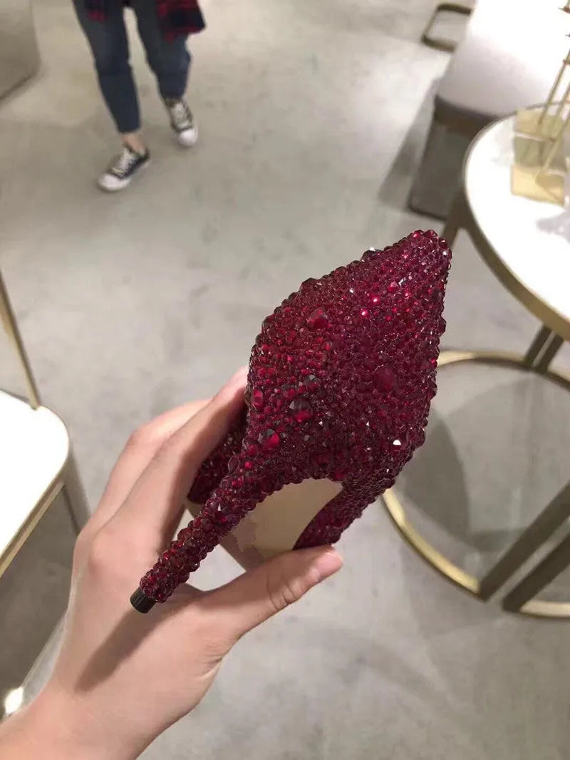 Women's gold pointed toe high heels with rhinestones and sequins on a 7cm stiletto heel