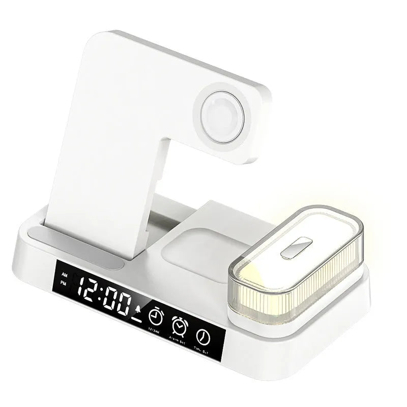 White 4-in-1 wireless charger station with foldable stand, alarm clock display, and RGB night light charging multiple devices