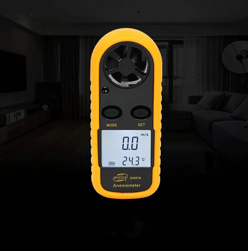 Orange digital portable wind speed measuring instrument with display showing wind speed readings