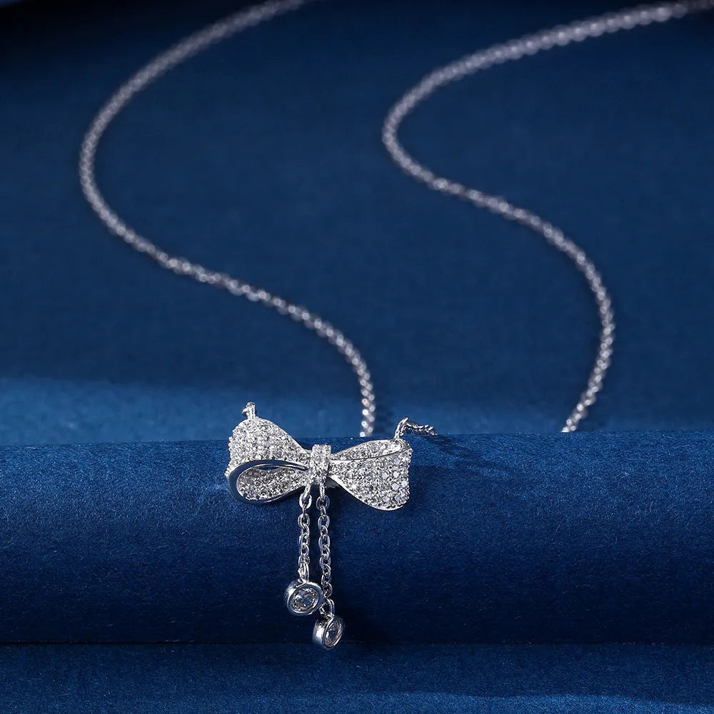 S925 sterling silver bow necklace with adjustable 40-45cm chain and electroplated silver finish