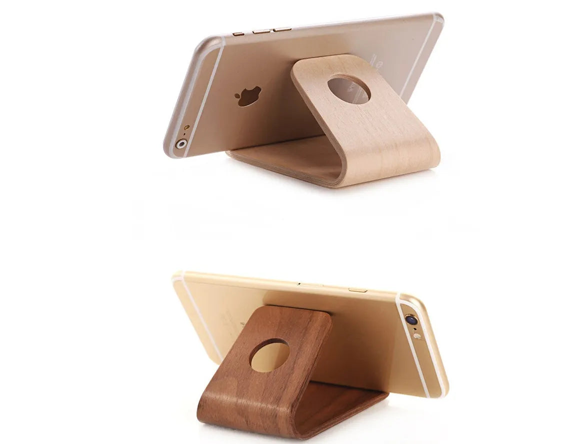 Walnut and white maple wooden stands holding iPhones at viewing angles