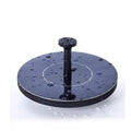 Black solar floating fountain with 4 nozzle attachments in garden pond setting