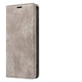 Magnetic flip phone case in grey colour with TPU and leather materials, showing closed flap for iPhone protection