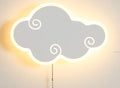 Modern white cloud-shaped children's wall lamp with acrylic shade mounted on a blue wall.