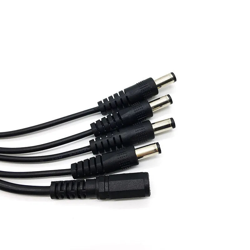 Black DC monitoring power cord with one input and four output connectors for CCTV cameras