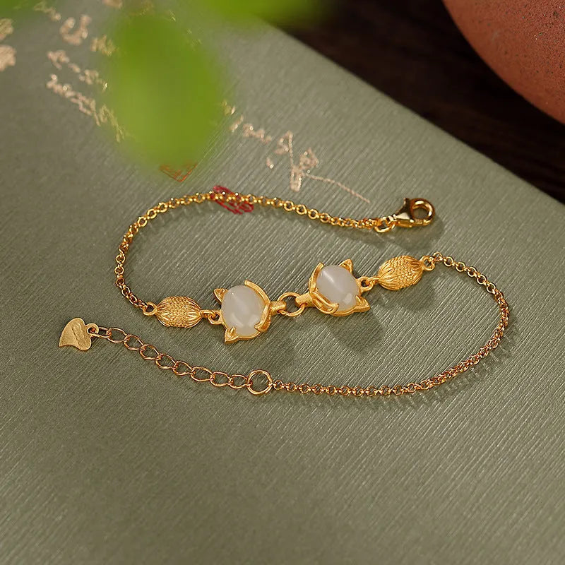 925 silver women's bracelet with fox charm and genuine Hetian jade stone on adjustable chain.