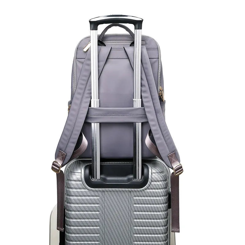 Classic black women's Oxford cloth backpack with large main compartment and breathable back panel.