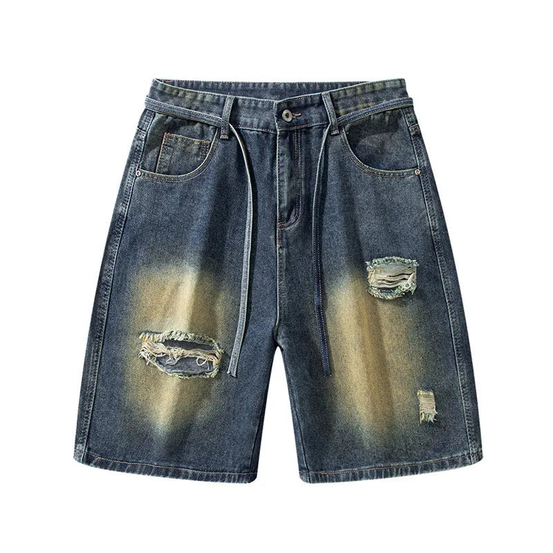 Loose fit retro blue distressed jeans on man showing cotton denim construction and street style detailing