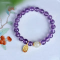 Amethyst purple geometric crystal bead bracelet ornament on a wrist.