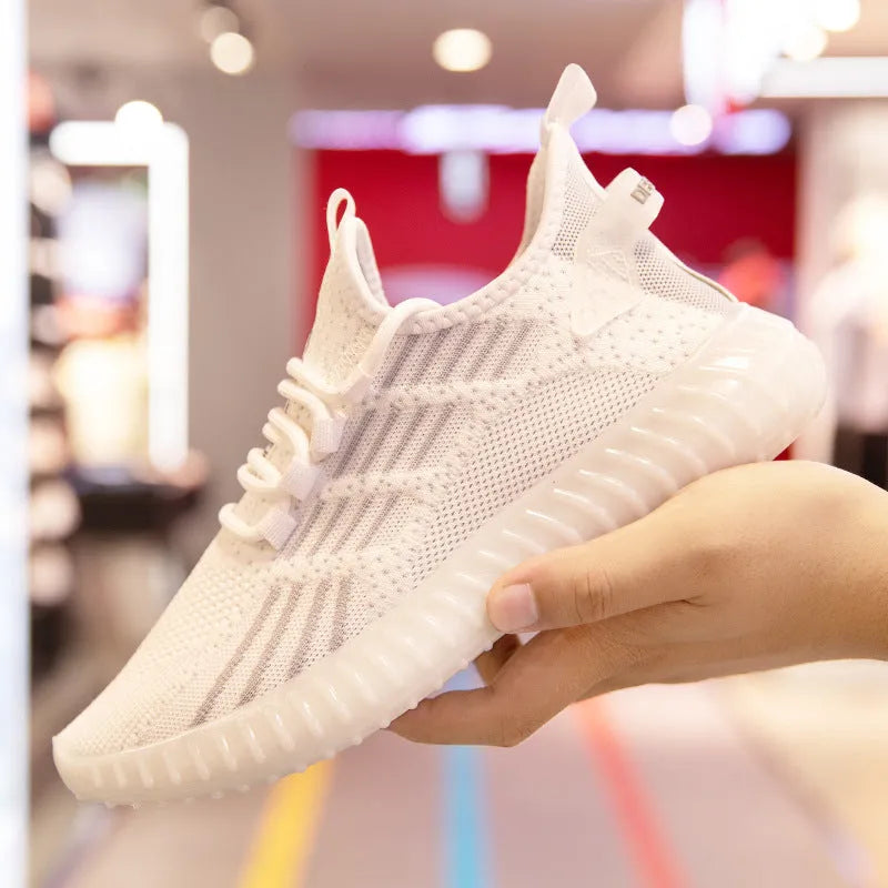 Men's white breathable flying fabric sports shoes with mesh lining and platform heel on a neutral background