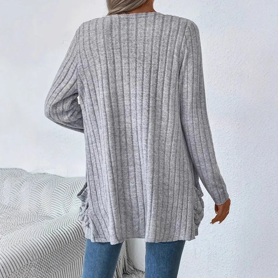 Solid colour long sleeve cardigan knitwear with two pockets, shown in granny grey.
