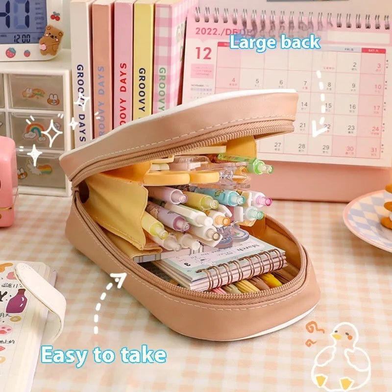 Transparent PVC pencil case with cartoon design showing pens and pencils inside