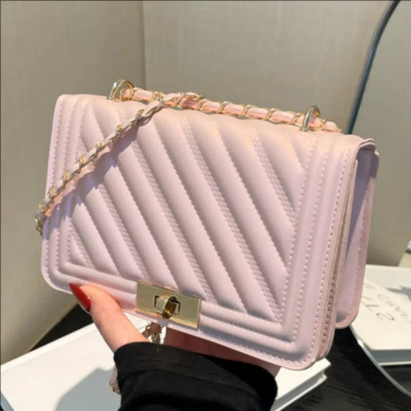 Single shoulder crossbody bag in PU with stitching detail, horizontal rectangle shape, shown in one of 14 colours