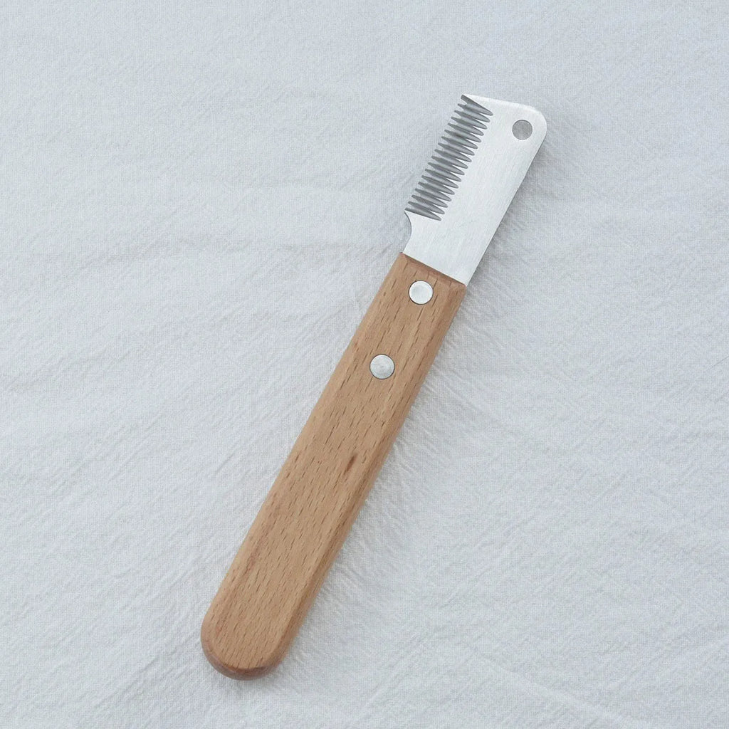 Pet stripping comb with wood handle for removing floating hair from cats and dogs, showing long and short sizes